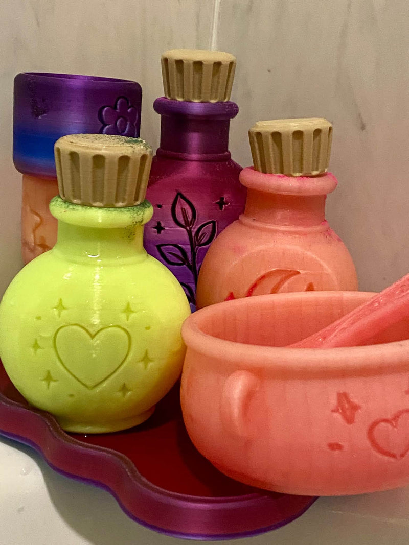 Bath bomb potion set with 3D-printed potion bottles and cauldron by Sudsy Sisters