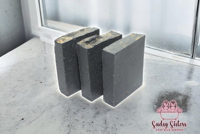 Black Magic goat milk soap bar with cedar musk and rose by Sudsy Sisters