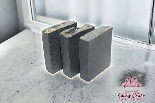 Black Magic goat milk soap bar with cedar musk and rose by Sudsy Sisters
