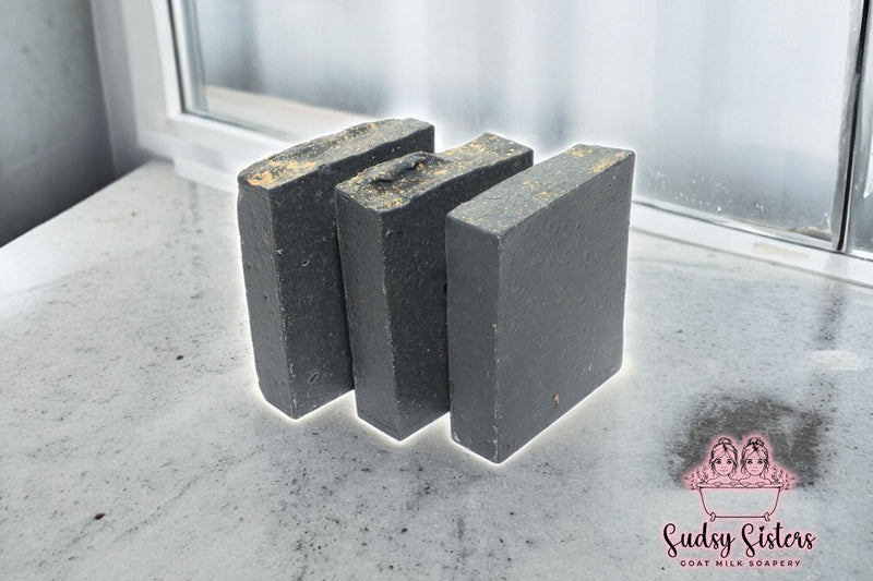 Black Magic goat milk soap bar with cedar musk and rose by Sudsy Sisters